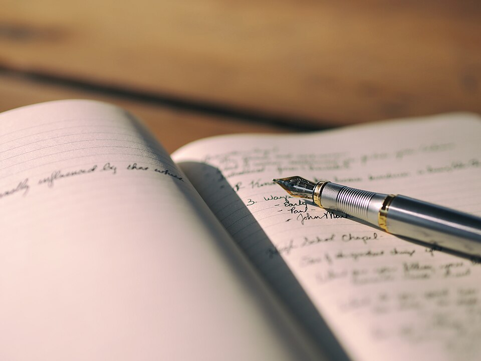 Fountain pen on an open notebook